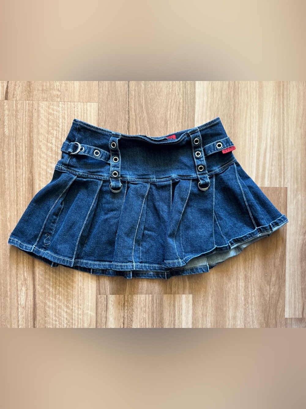 Tripp NYC Dark Blue Denim Pleated Mini Skirt with Grommet Detail